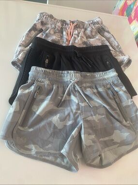 3 pairs Athleta Girl Gray/ Black Athletic Shorts. Size 8/10. Great condition.